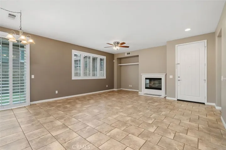 living/dining room with fireplace