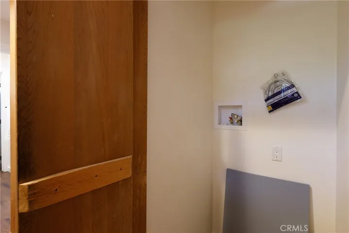 This is behind the cedar panels, washer and dryer hookups.