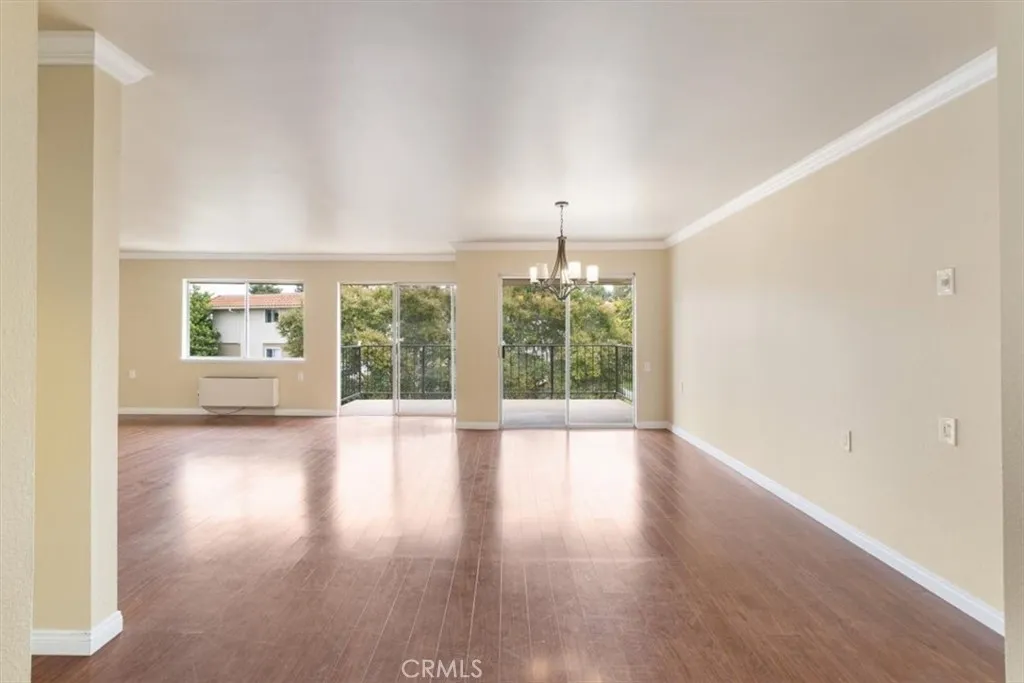 Living and Dining Areas with South Facing Balcony Access.