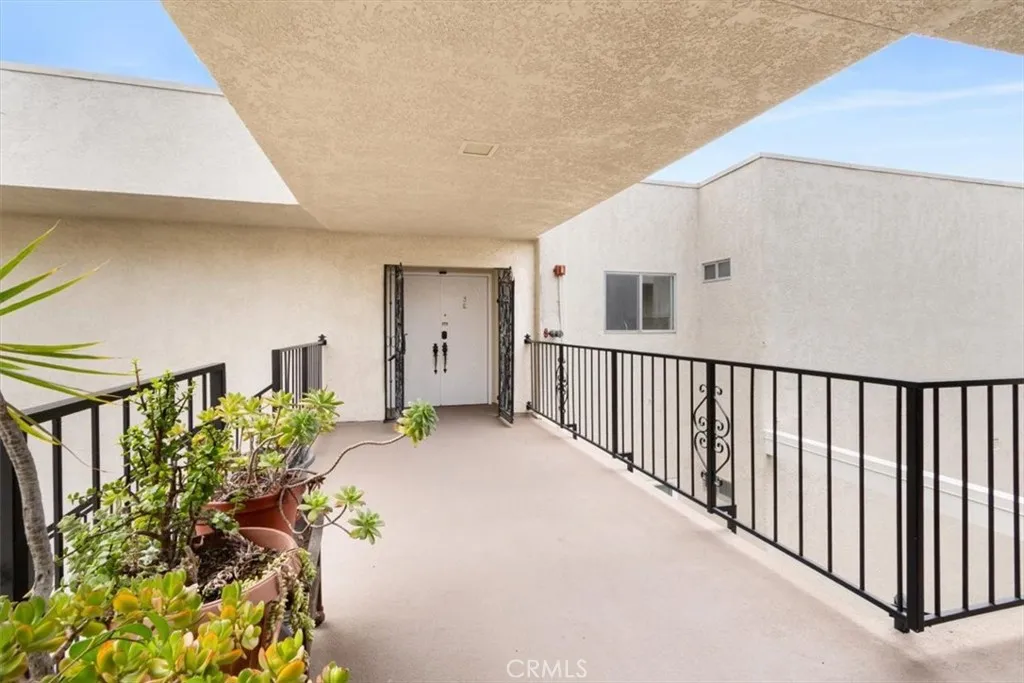Entry Landing with Privacy Gate and Double Doors.