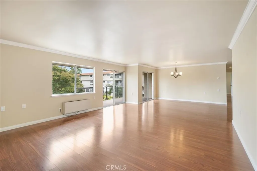 Living and Dining Areas with South Facing Balcony Access.