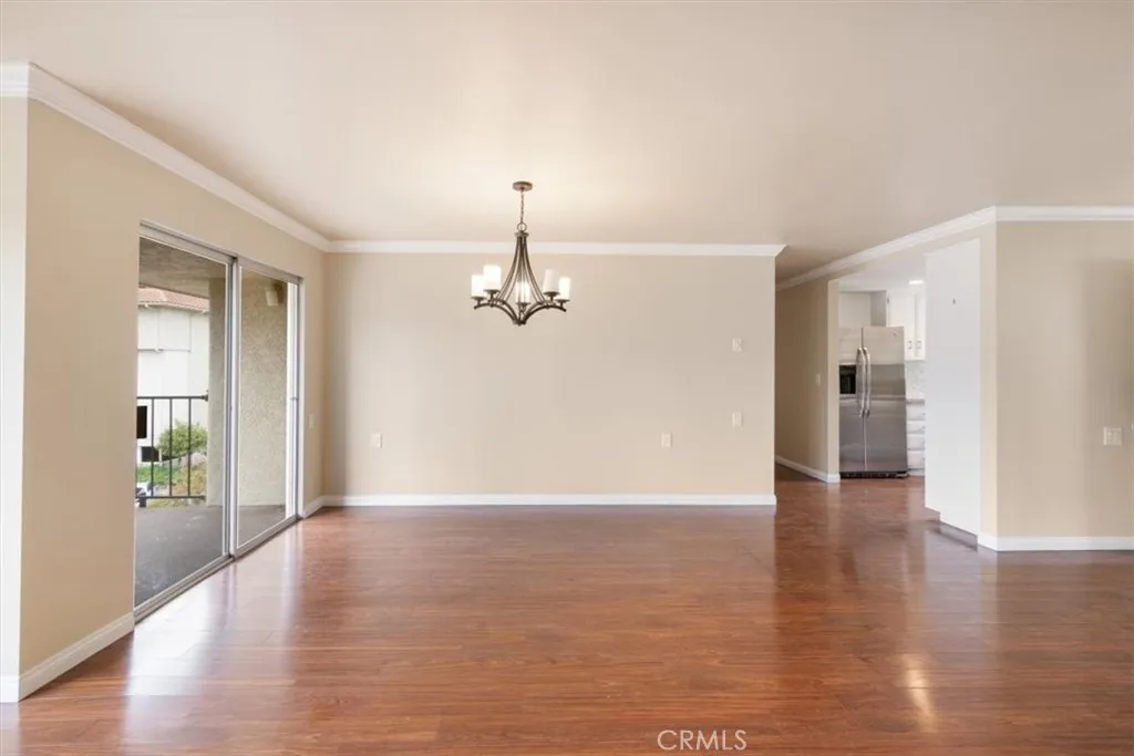 Living and Dining Areas with South Facing Balcony Access.