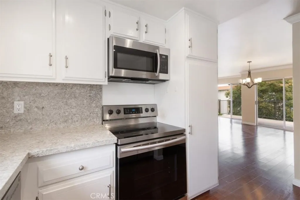 Kitchen off of Dining and Living Areas.