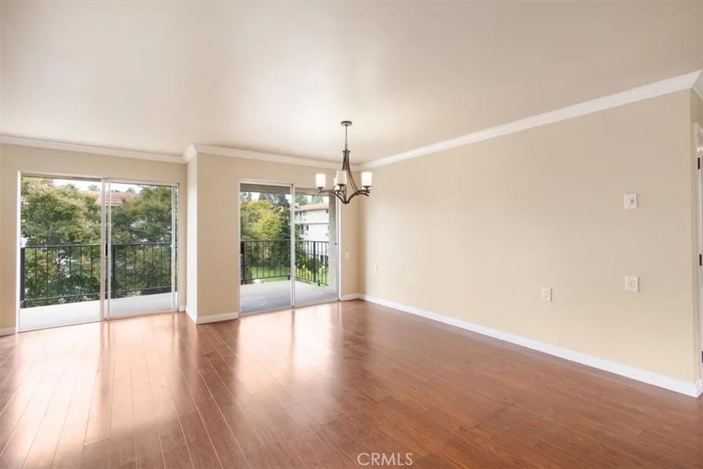 Living and Dining Areas with South Facing Balcony Access.