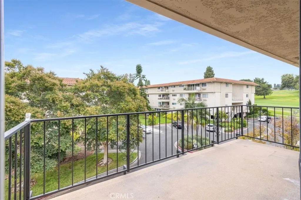 Balcony with Golf Course and Tree Views.