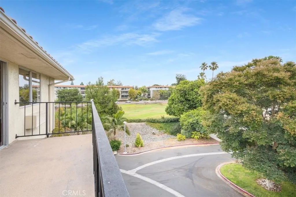 Balcony with Golf Course and Tree Views.
