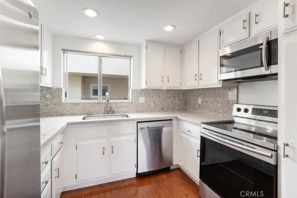 Kitchen off of Dining and Living Areas.
