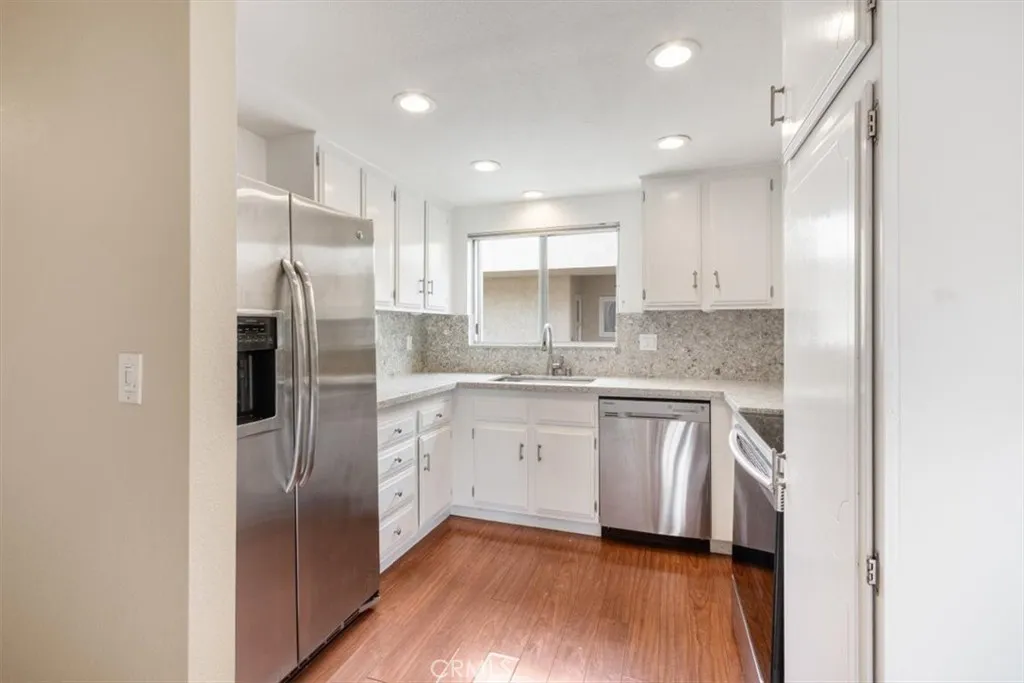 Kitchen off of Dining and Living Areas.