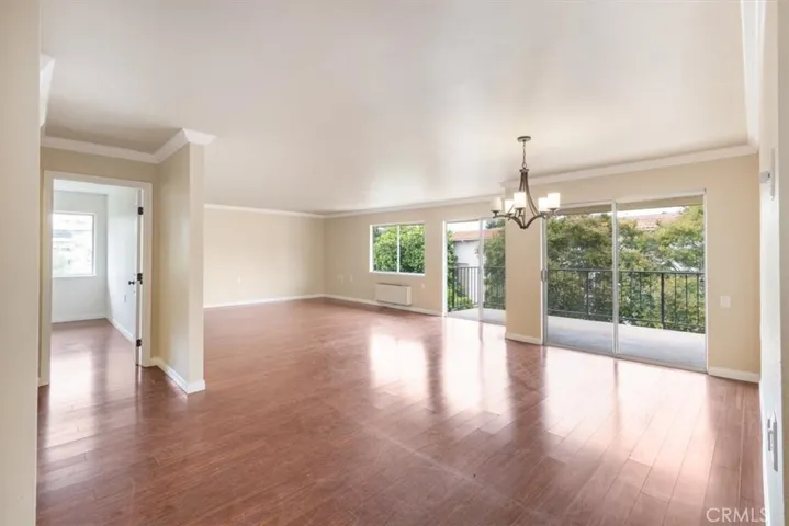 Living and Dining Areas with South Facing Balcony Access.