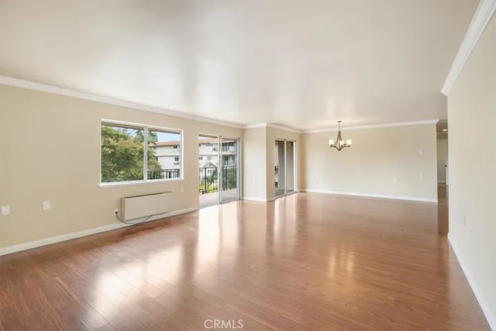 Living and Dining Areas with South Facing Balcony Access.