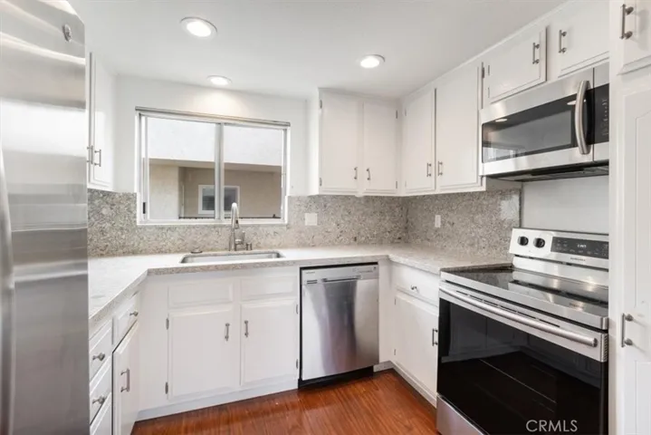 Kitchen off of Dining and Living Areas.