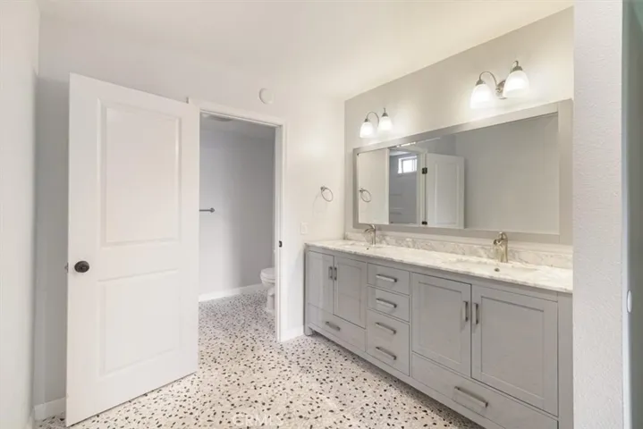 Updated Primary Bathroom with Double Vanities.