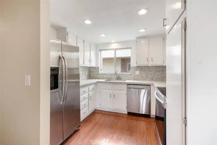 Kitchen off of Dining and Living Areas.