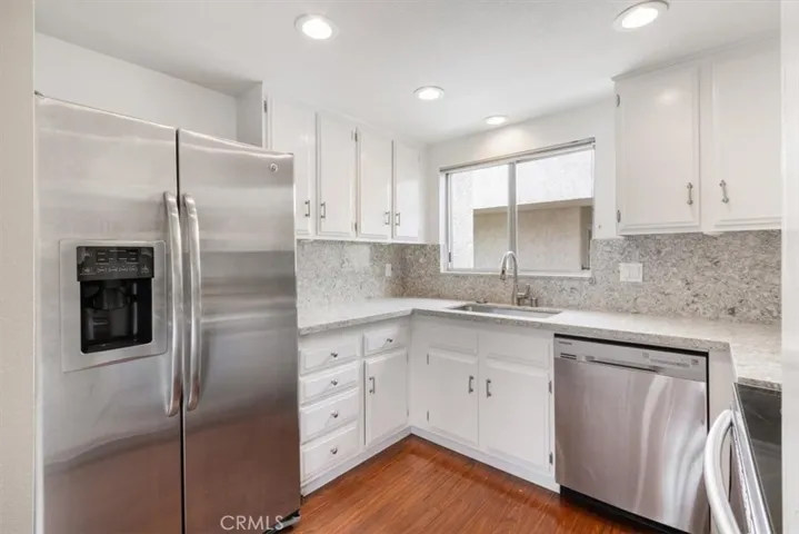 Kitchen off of Dining and Living Areas.