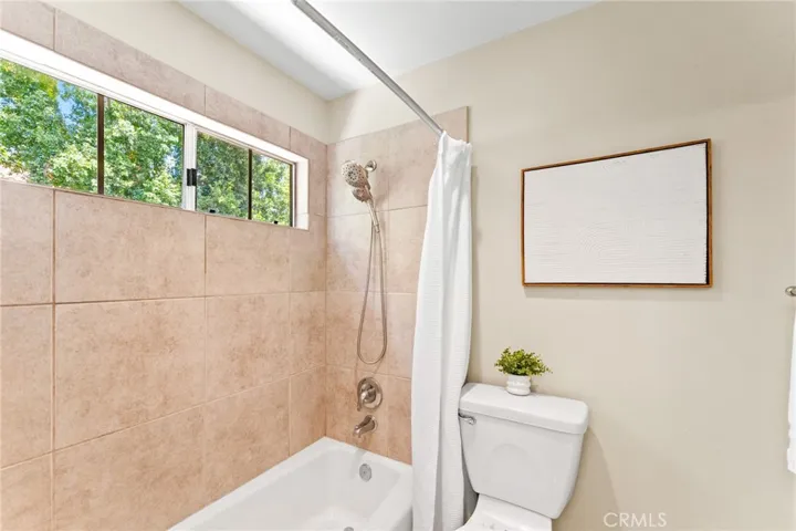 Guest bathroom, door separate vanity and bath.