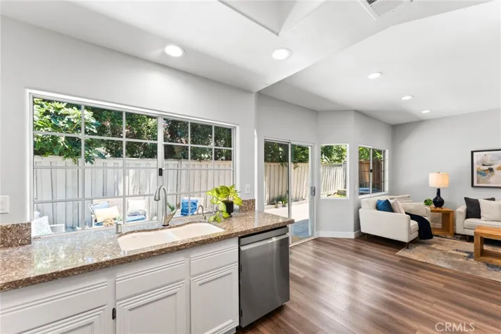 Kitchen Showcasing the view into the back yard and open to the Family Room.