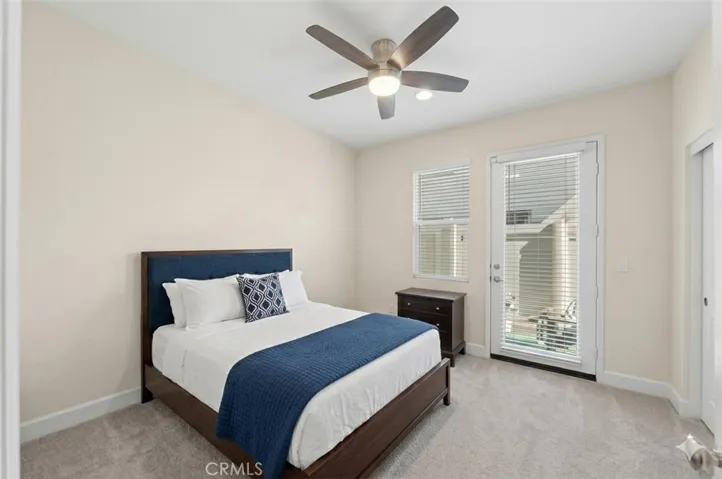 Bedroom for ADU with door to ADU Private Back Yard digitally enhanced