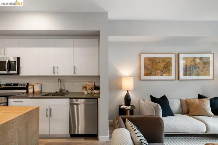Living room featuring light wood-style floors and baseboards