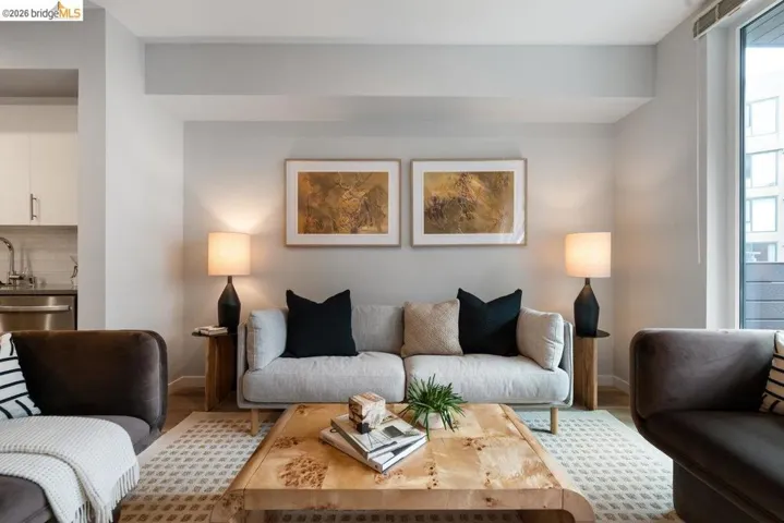 Living area featuring baseboards and wood finished floors