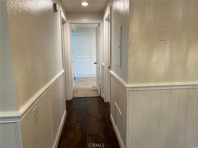Pretty wainscoting on the living room, dining room and hall for a lovely fresh upscale look.