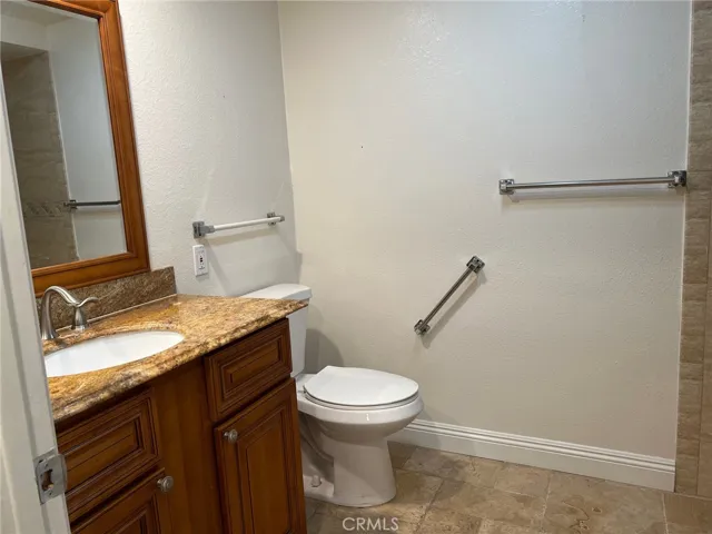 The hall bathroom features a newer vanity.
