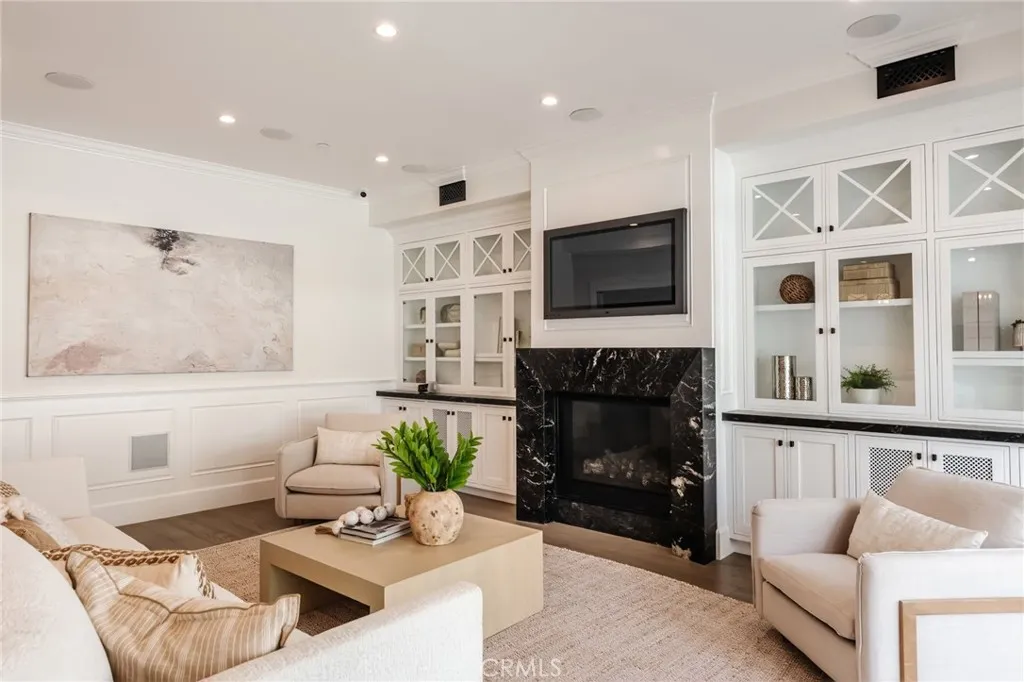 An abundance of built-ins and large fireplace can be found in the living room.