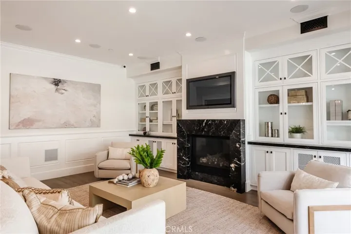 An abundance of built-ins and large fireplace can be found in the living room.