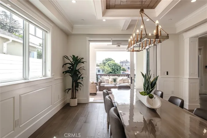 A highly desirable indoor-outdoor connection is created from the dining room to the patio