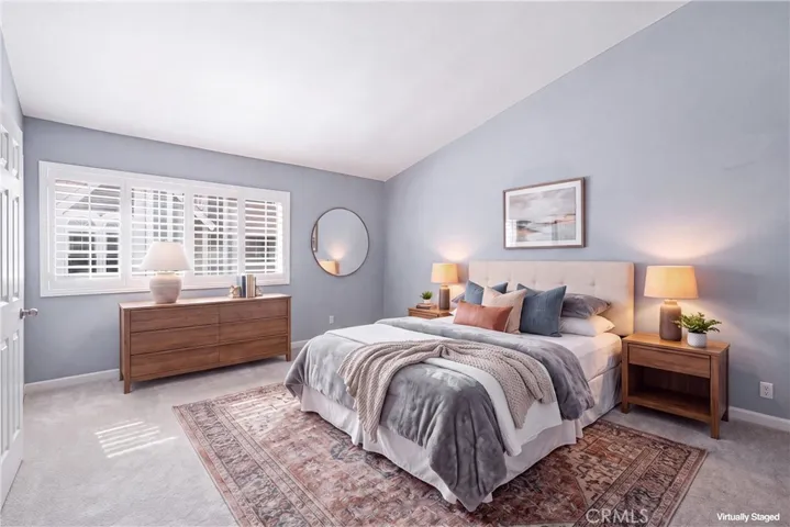 Primary bedrooom with vaulted ceilings
