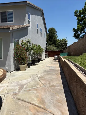 East side of House, Potted Plants do not stay.