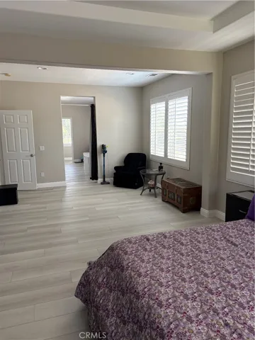 Master Bedroom with ample room for Seating or Office Desk to be added. This view is looking towards the Master Bath & Walk-in Closets.