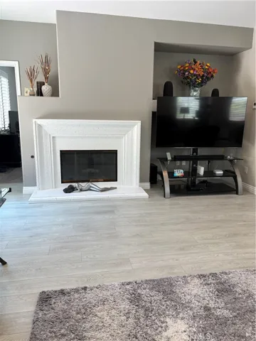 Great Room with TV, Fireplace and also showing Door to Downstairs Master Bedroom.
From this room use the Sliding Door to Backyard Pool, Jacuzzi & Built-in Bar-B-Q.