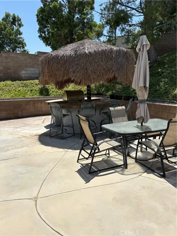 Backyard with seating area by Pool & Jacuzzi.