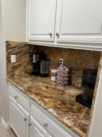 Granite Counter Coffee Bar / Dry Bar with extra cabinets just off the Kitchen.