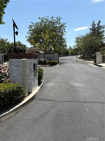 Front Gate to Larkspur Complex to put in Gate Code.