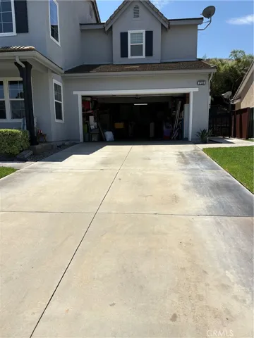 Two Car Garage Door with 2 Cars wide inside & 2 Cars deep so room for 4 Cars. With this layout you can put in 2 Cars and still have a lot of storage space if you need it or build an inside ADU to Rent. The Driveway is long also, check it out.