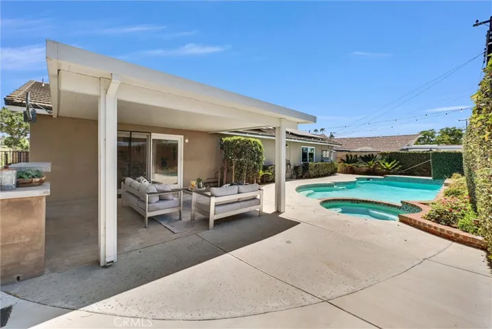 Pool life - this home is ready for entertaining, hosting and relaxing. Private yard with covered patio and spa.