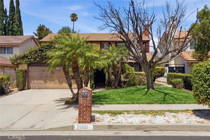 Welcome to 21823 Hiawatha St! Grass is virtually made greener.