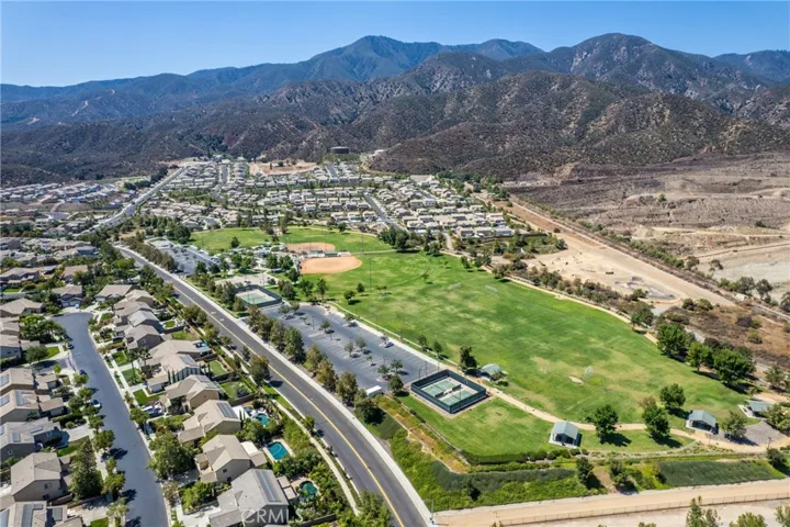 Aerial view of lush green spaces and parks within the community.