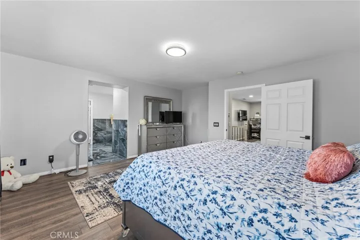 Comfortable primary bedroom with ample space and natural light.