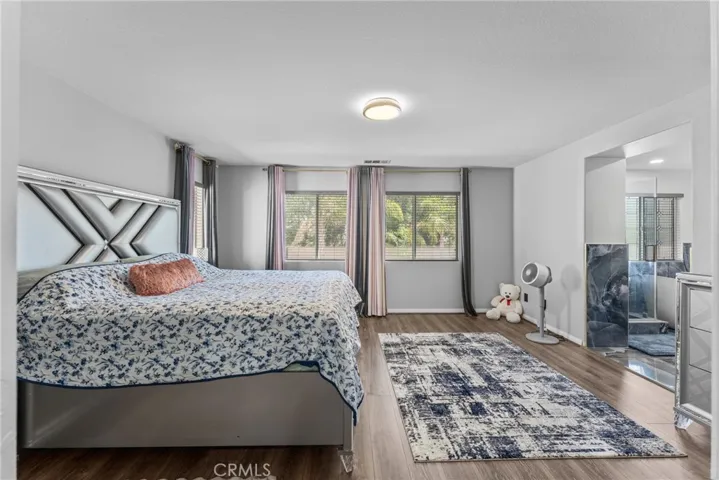 Comfortable primary bedroom with ample space and natural light.