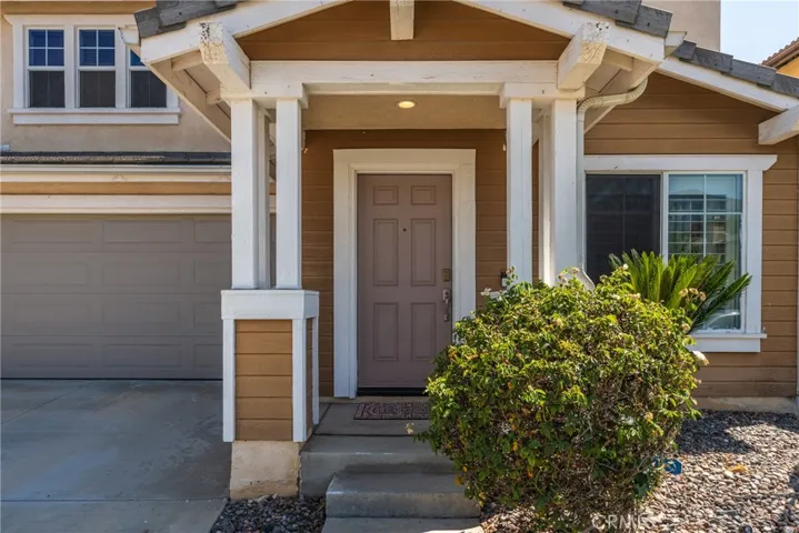 Charming front porch and entryway welcoming you into the home.