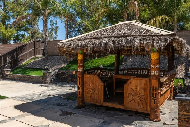Charming backyard gazebo ideal for enjoying sunny afternoons.