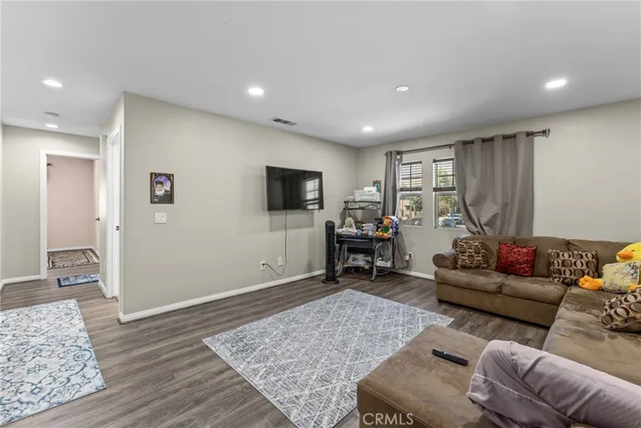 Bright and airy family living room with large windows and custom drapes.