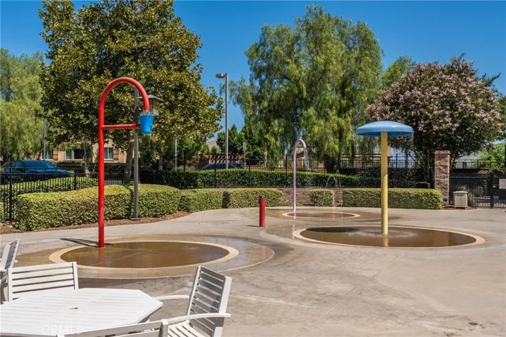 Fantastic community pool and splash pad perfect for outdoor enjoyment.
