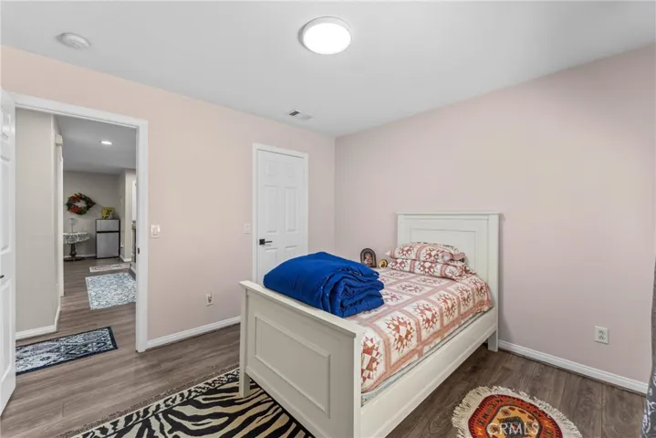 Comfortable bedroom featuring soft natural light.