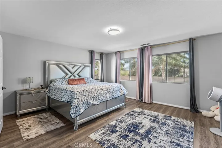 Comfortable primary bedroom with ample space and natural light.