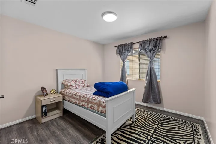 Well-appointed bedroom featuring a serene color palette.