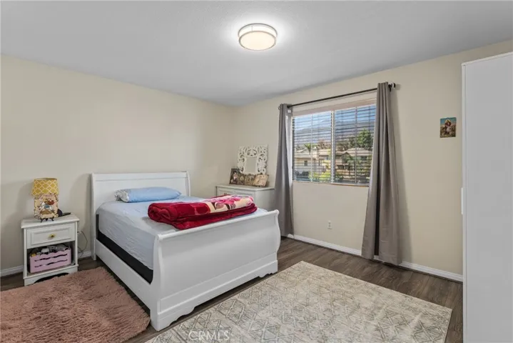 Spacious bedroom with clean lines and ample natural light.