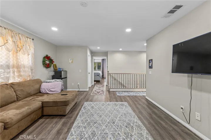 Additional view of the relaxing living space leading to the staircase.